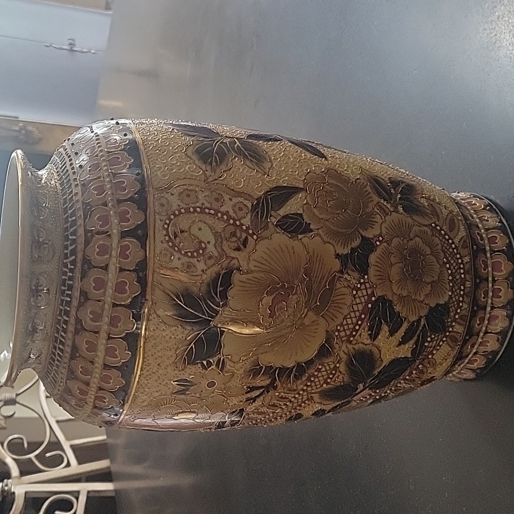Gold and Black Ornate Vase with Intricate Patterns